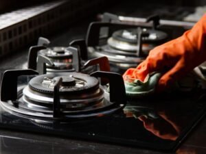 person repairing gas stove