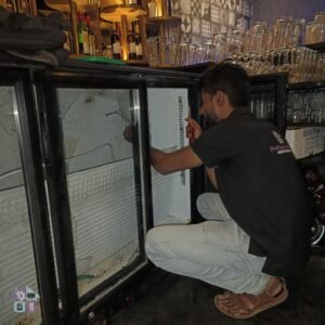 ProTouch Appliance technician repairing commercial freezer