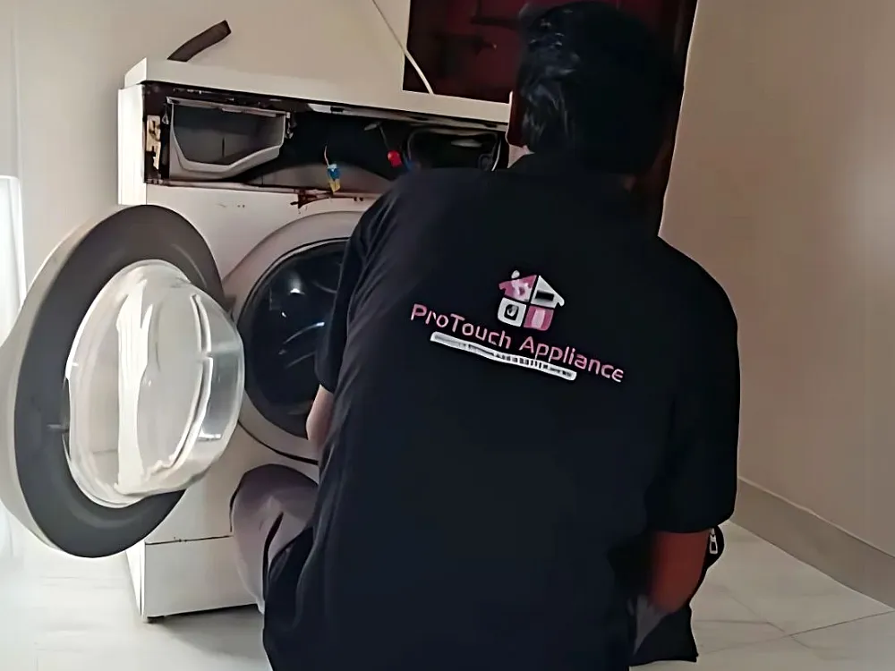 ProTouch technician repairing a washing machine